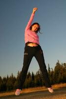 pretty girl jumping in a air photo