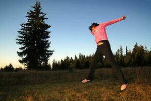 pretty girl jumping in a air photo