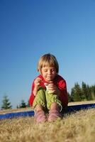 cute little girl eating healthy food outdoor photo