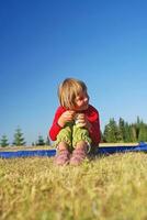 cute little girl eating healthy food outdoor photo