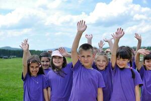 happy kids group  have fun in nature photo