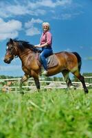 happy woman  ride  horse photo