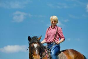 happy woman  ride  horse photo