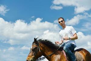 man ride horse photo