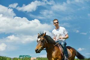 man ride horse photo