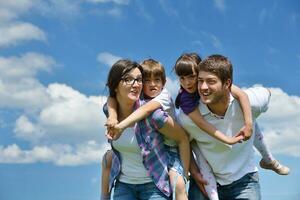 happy young family have fun outdoors photo