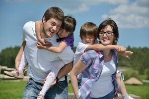 happy young family have fun outdoors photo