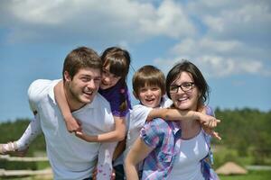 happy young family have fun outdoors photo