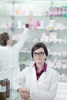 team of pharmacist chemist woman  in pharmacy drugstore photo