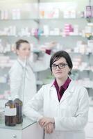 team of pharmacist chemist woman  in pharmacy drugstore photo