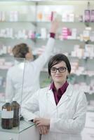 team of pharmacist chemist woman  in pharmacy drugstore photo