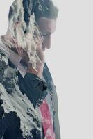 double exposure of  business man with  mobile phone and mountain in winter photo