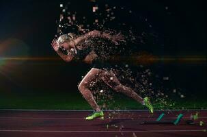 pixelated design of woman  sprinter leaving starting blocks photo