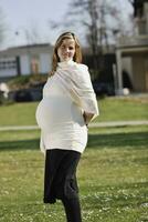 happy young pregnant woman outdoor photo