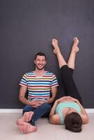 pregnant couple relaxing on the floor photo