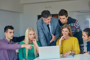 group of students getting suppport from teacher photo