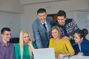 group of students getting suppport from teacher photo