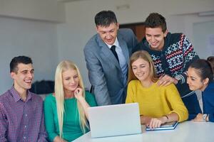 group of students getting suppport from teacher photo