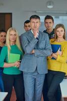 group portrait of teacher with students photo