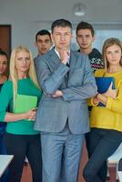 group portrait of teacher with students photo