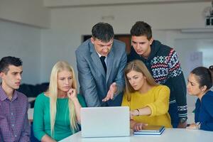 group of students getting suppport from teacher photo