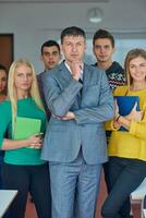 group portrait of teacher with students photo