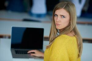 portrait of happy smilling student girl at tech classroom photo