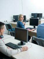 students group in computer lab classroom photo