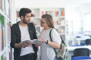 students couple  in school  library photo