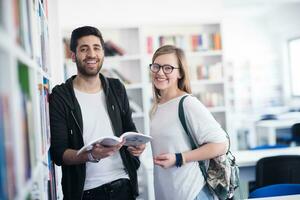 students couple  in school  library photo