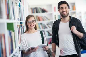 students couple  in school  library photo