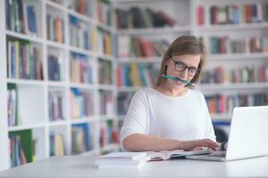 female student study in school library photo