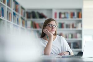 female student study in school library photo