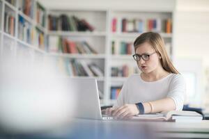 female student study in school library photo