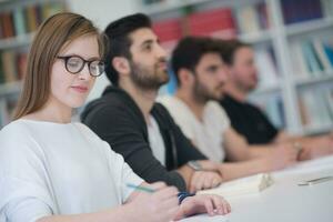 group of students study together in classroom photo