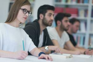 group of students study together in classroom photo