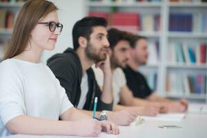 group of students study together in classroom photo