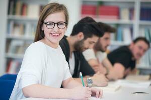 group of students study together in classroom photo