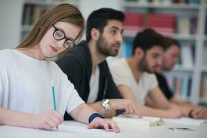 group of students study together in classroom photo