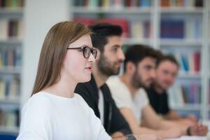 group of students study together in classroom photo