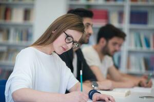 group of students study together in classroom photo