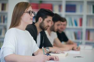 group of students study together in classroom photo