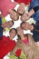 young friends staying together outdoor in the park photo