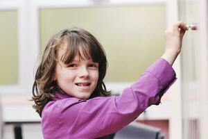 happy school girl on math classes photo