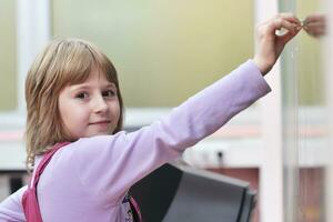 happy school girl on math classes photo