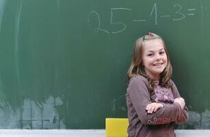 happy school girl on math classes photo