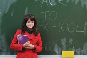 happy school girl on math classes photo