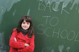 happy school girl on math classes photo