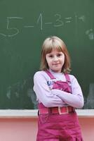 happy school girl on math classes photo