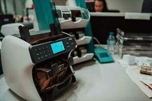 Sorted banknotes placed on the table after it is counted on the electronic money counting machine photo